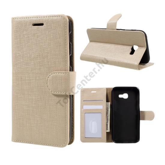Samsung Galaxy A3 (2017) (SM-A320F) Tok álló, bőr (FLIP, mágneses, oldalra nyíló, asztali tartó funkció, textil hatás) ARANY
